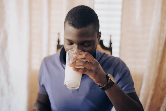 man enjoying some milk